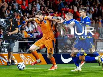 Netherlands forward Wout Weghorst and Bosnia and Herzegovina defender Nikola Katic during the match between the Netherlands and Bosnia and H...