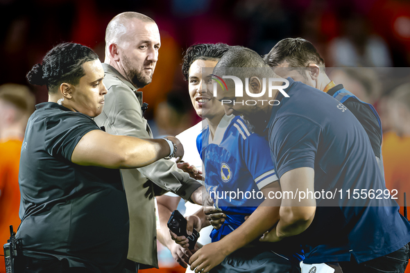 A supporter of Bosnia and Herzegovina stands on the pitch during the match between the Netherlands and Bosnia and Herzegovina at the Philips...