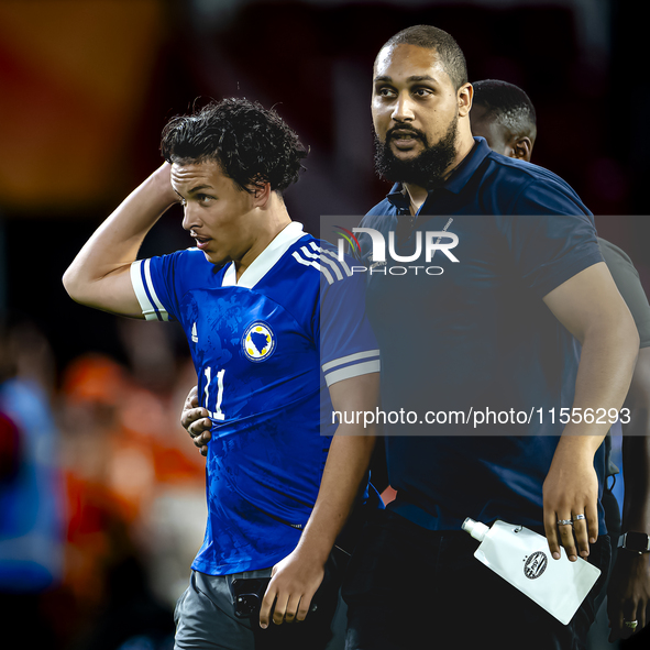 A supporter of Bosnia and Herzegovina stands on the pitch during the match between the Netherlands and Bosnia and Herzegovina at the Philips...