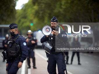 A riot policeman shouts the first warning before the use of force towards protesters. Between 5,000 and 8,000 protesters march in Toulouse,...