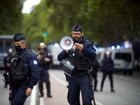 A riot policeman shouts the first warning before the use of force towards protesters. Between 5,000 and 8,000 protesters march in Toulouse,...