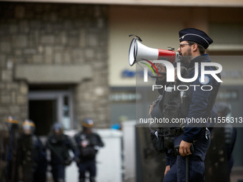 A riot policeman shouts the first warning before the use of force towards protesters. Between 5,000 and 8,000 protesters march in Toulouse,...