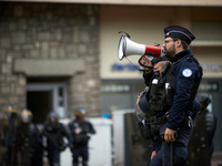 A riot policeman shouts the first warning before the use of force towards protesters. Between 5,000 and 8,000 protesters march in Toulouse,...