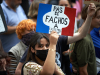 A young woman holds a cardboard sign reading 'No faf in our National Assembly'. Between 5,000 and 8,000 protesters march in Toulouse, France...