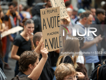 A placard reads 'People have voted, Macron stole it'. Between 5,000 and 8,000 protesters march in Toulouse and cities across France on Satur...