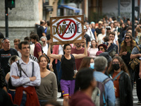 A woman holds a placard reading 'Deniedcracy'. Between 5,000 and 8,000 protesters march in Toulouse and cities across France on Saturday to...