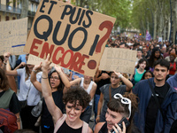 A protester holds a placard reading 'And now, what else?'. Between 5,000 and 8,000 protesters march in Toulouse, France, on September 7, 202...