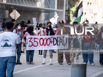 On September 7, 2024, in Washington, DC, two dozen pro-Palestine/Gaza protesters protest outside the Washington Convention Center, where the...