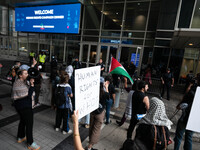 On September 7, 2024, in Washington, DC, two dozen pro-Palestine/Gaza protesters protest outside the Washington Convention Center, where the...