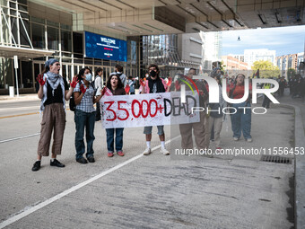 On September 7, 2024, in Washington, DC, two dozen pro-Palestine/Gaza protesters protest outside the Washington Convention Center, where the...