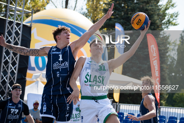 Mateusz Kazmierczak and Maksymilian Motel participate in the LOTTO 3x3 League basketball game in Sosnowiec, Poland, on September 7, 2024. Th...