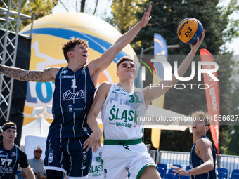 Mateusz Kazmierczak and Maksymilian Motel participate in the LOTTO 3x3 League basketball game in Sosnowiec, Poland, on September 7, 2024. Th...