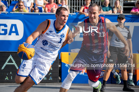 Wojciech Leszczynski and Marcin Biranowski participate in the LOTTO 3x3 League basketball game in Sosnowiec, Poland, on September 7, 2024. T...