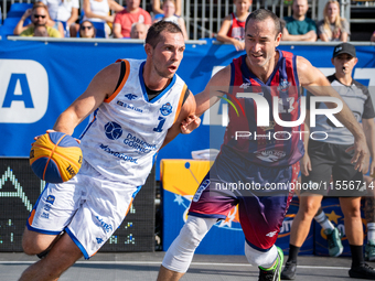 Wojciech Leszczynski and Marcin Biranowski participate in the LOTTO 3x3 League basketball game in Sosnowiec, Poland, on September 7, 2024. T...