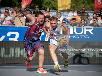 Patryk Andres and Krystian Zawadzki participate in the LOTTO 3x3 League basketball game in Sosnowiec, Poland, on September 7, 2024. The Lott...