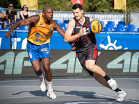 Patryk Przyborowski and Michael Hicks participate in the LOTTO 3x3 League basketball game in Sosnowiec, Poland, on September 7, 2024. The Lo...