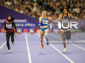 Karisma Tiarani of Indonesia, Martina Caironi of Italy, and Okoh Ndidikama of the UK compete in the Women's 100m - T63 Final at Stade de Fra...