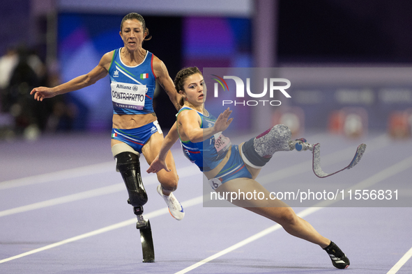 Ambra Sabatini (R) of Italy gets in Monica Contafatto's (ITA) way and makes her fall during the Women's 100m - T63 Final at Stade de France...