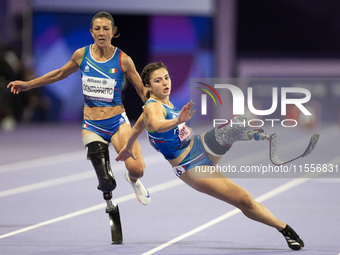 Ambra Sabatini (R) of Italy gets in Monica Contafatto's (ITA) way and makes her fall during the Women's 100m - T63 Final at Stade de France...