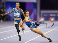 Ambra Sabatini (R) of Italy gets in Monica Contafatto's (ITA) way and makes her fall during the Women's 100m - T63 Final at Stade de France...