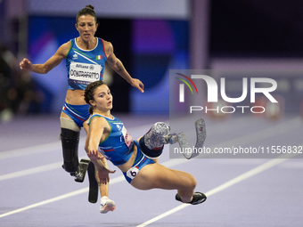 Ambra Sabatini (R) of Italy gets in Monica Contafatto's (ITA) way and makes her fall during the Women's 100m - T63 Final at Stade de France...