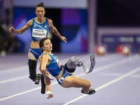 Ambra Sabatini (R) of Italy gets in Monica Contafatto's (ITA) way and makes her fall during the Women's 100m - T63 Final at Stade de France...