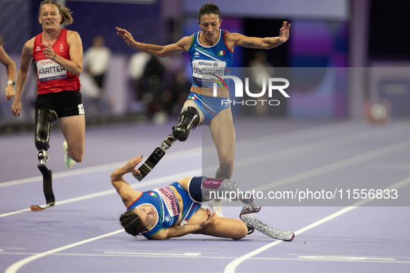 Ambra Sabatini (R) of Italy gets in Monica Contafatto's (ITA) way and makes her fall during the Women's 100m - T63 Final at Stade de France...