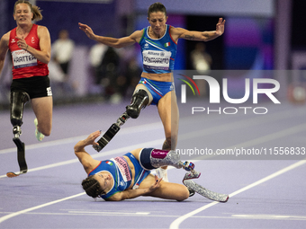 Ambra Sabatini (R) of Italy gets in Monica Contafatto's (ITA) way and makes her fall during the Women's 100m - T63 Final at Stade de France...