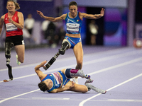 Ambra Sabatini (R) of Italy gets in Monica Contafatto's (ITA) way and makes her fall during the Women's 100m - T63 Final at Stade de France...