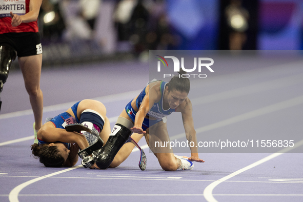 Ambra Sabatini (R) of Italy gets in Monica Contafatto's (ITA) way and makes her fall during the Women's 100m - T63 Final at Stade de France...