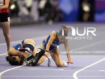 Ambra Sabatini (R) of Italy gets in Monica Contafatto's (ITA) way and makes her fall during the Women's 100m - T63 Final at Stade de France...