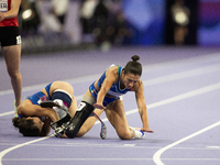 Ambra Sabatini (R) of Italy gets in Monica Contafatto's (ITA) way and makes her fall during the Women's 100m - T63 Final at Stade de France...