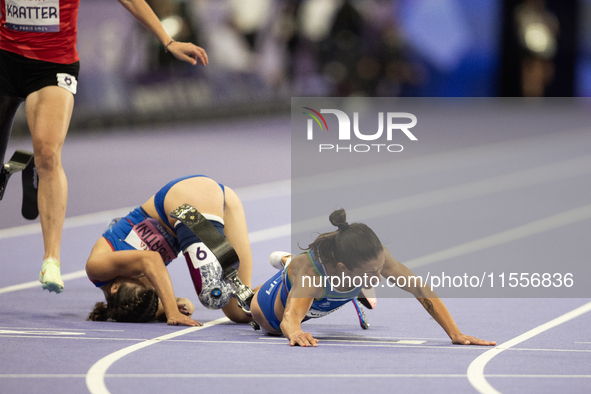 Ambra Sabatini (R) of Italy gets in Monica Contafatto's (ITA) way and makes her fall during the Women's 100m - T63 Final at Stade de France...