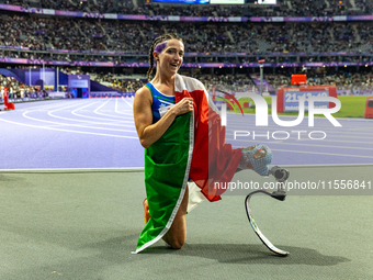 Martina Caironi of Italy reacts after she wins the Women's 100m - T63 Final at State de France during the Paris 2024 Paralympic Games in Par...