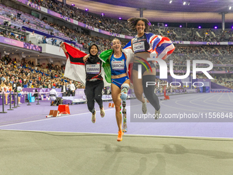 Karisma Tiarani of Indonesia, Martina Caironi of Italy, and Okoh Ndidikama of the UK react after the Women's 100m - T63 Final at Stade de Fr...