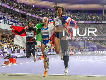 Karisma Tiarani of Indonesia, Martina Caironi of Italy, and Okoh Ndidikama of the UK react after the Women's 100m - T63 Final at Stade de Fr...