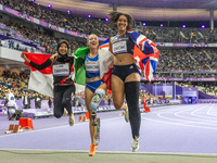 Karisma Tiarani of Indonesia, Martina Caironi of Italy, and Okoh Ndidikama of the UK react after the Women's 100m - T63 Final at Stade de Fr...