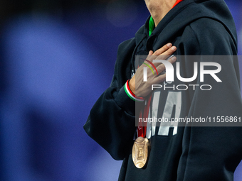 Monica Contrafatto of Italy stands on the podium after she wins the bronze medal in the Women's 100m - T63 Final at Stade de France during t...