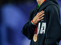 Monica Contrafatto of Italy stands on the podium after she wins the bronze medal in the Women's 100m - T63 Final at Stade de France during t...