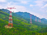 The iron tower of the 800 kV UHVDC power transmission project is built in Jinshang-Hubei Province, Chongqing, China, on September 7, 2024. T...