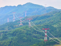 The iron tower of the 800 kV UHVDC power transmission project is built in Jinshang-Hubei Province, Chongqing, China, on September 7, 2024. T...