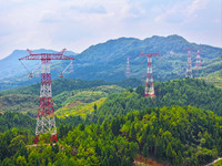 The iron tower of the 800 kV UHVDC power transmission project is built in Jinshang-Hubei Province, Chongqing, China, on September 7, 2024. T...