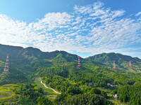 The iron tower of the 800 kV UHVDC power transmission project is built in Jinshang-Hubei Province, Chongqing, China, on September 7, 2024. T...