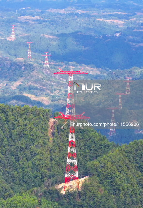 The iron tower of the 800 kV UHVDC power transmission project is built in Jinshang-Hubei Province, Chongqing, China, on September 7, 2024. T...