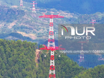 The iron tower of the 800 kV UHVDC power transmission project is built in Jinshang-Hubei Province, Chongqing, China, on September 7, 2024. T...