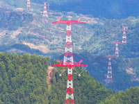 The iron tower of the 800 kV UHVDC power transmission project is built in Jinshang-Hubei Province, Chongqing, China, on September 7, 2024. T...