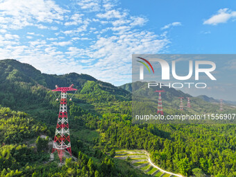 The iron tower of the 800 kV UHVDC power transmission project is built in Jinshang-Hubei Province, Chongqing, China, on September 7, 2024. T...