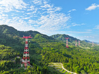 The iron tower of the 800 kV UHVDC power transmission project is built in Jinshang-Hubei Province, Chongqing, China, on September 7, 2024. T...