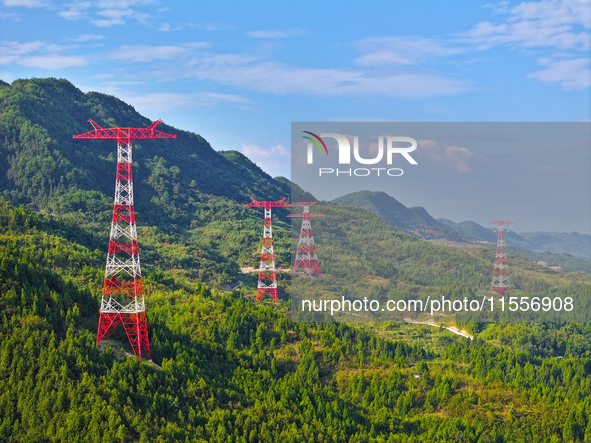 The iron tower of the 800 kV UHVDC power transmission project is built in Jinshang-Hubei Province, Chongqing, China, on September 7, 2024. T...