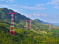 The iron tower of the 800 kV UHVDC power transmission project is built in Jinshang-Hubei Province, Chongqing, China, on September 7, 2024. T...